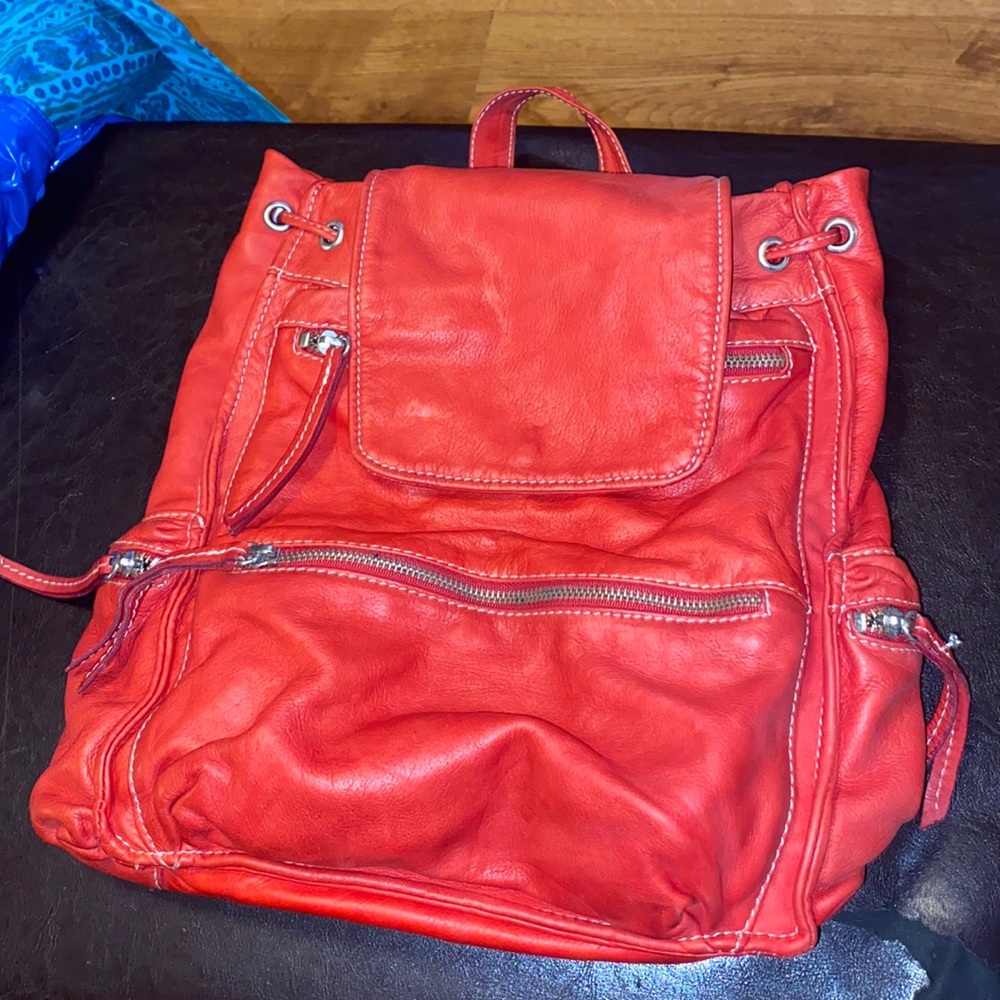 Stylish redish/orange backpack. FAUX-LEATHER